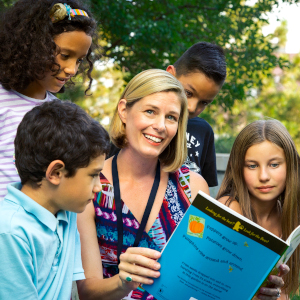 Jini reading to group of kids