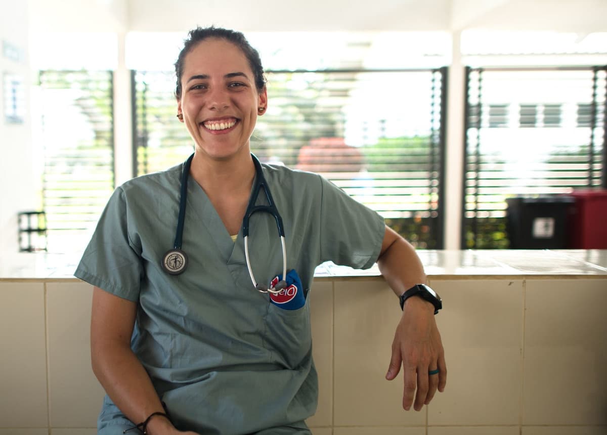 smiling doctor leaning on counter