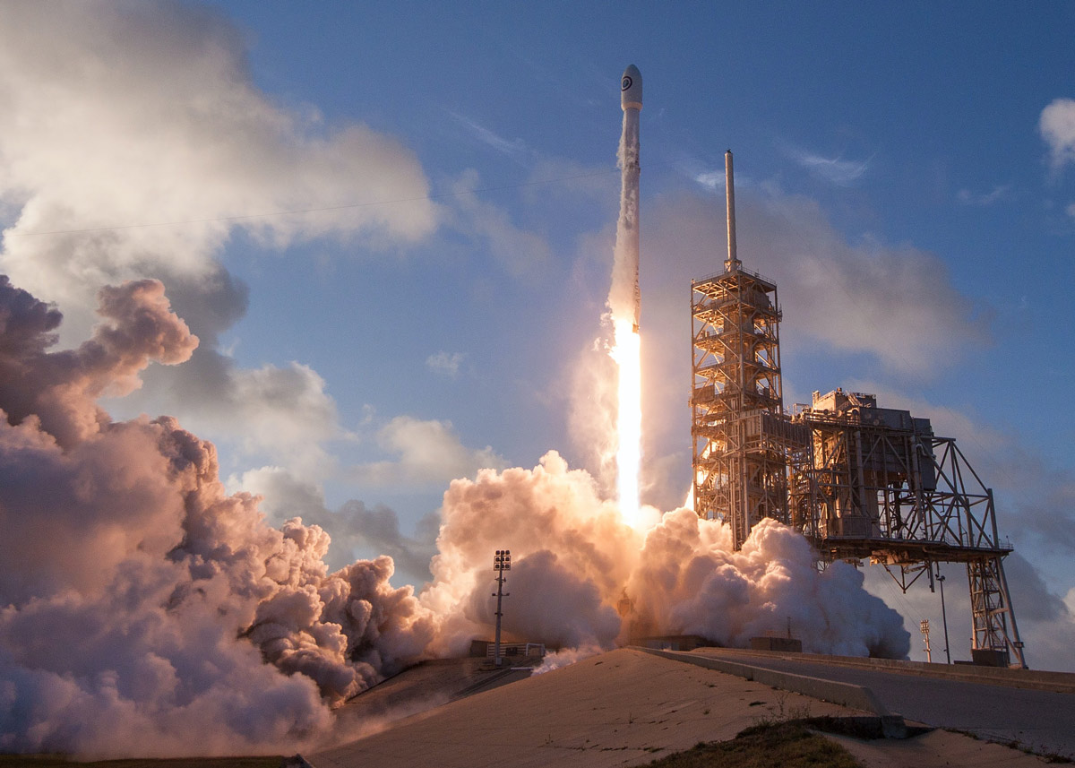 rocket launching with smoke around it