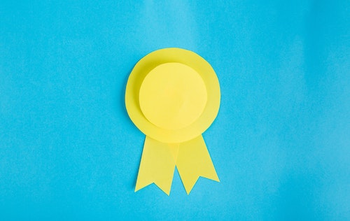 yellow award on blue background