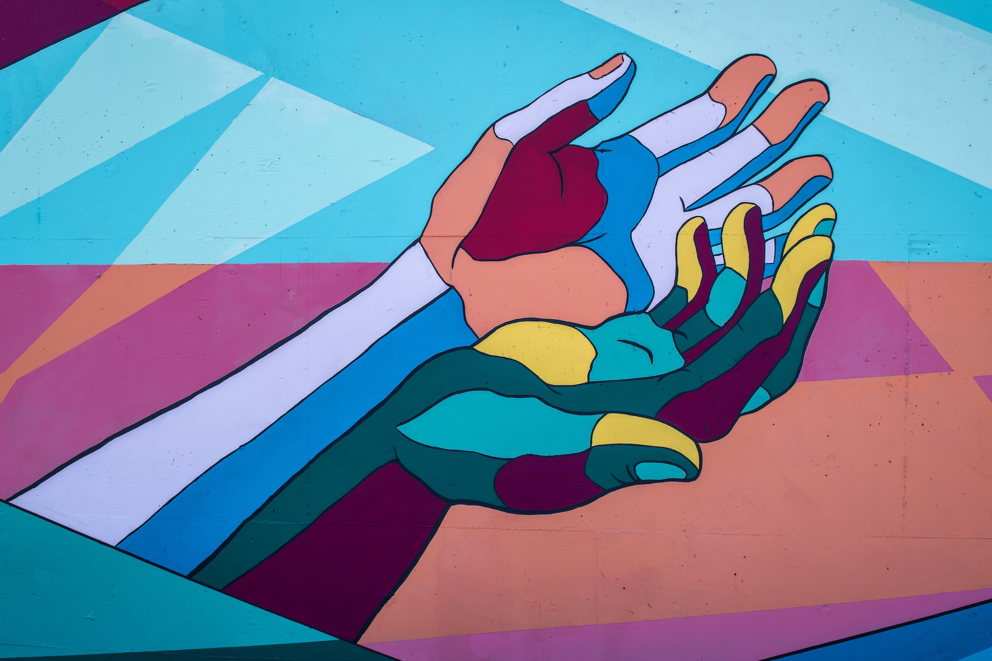 Mural with colorful painted hands