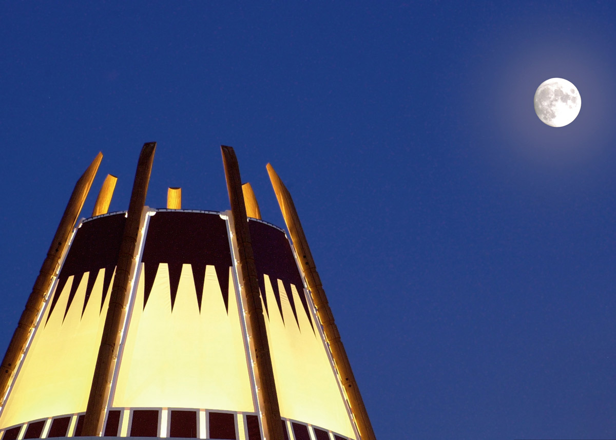 Top of the Nighthorse Campbell building at night with the moon out