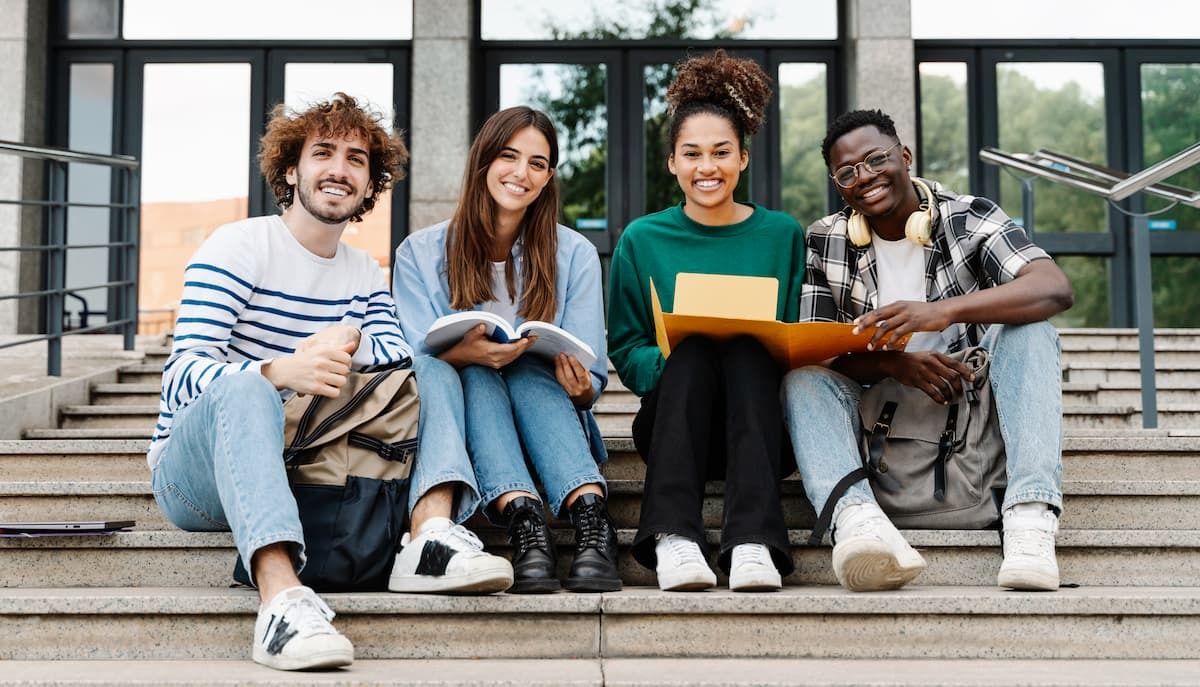 Multi ethnic group of Latin and African American college students smiling