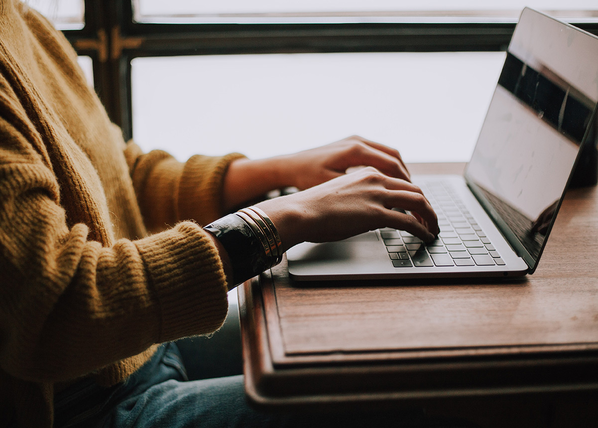 person typing on a computer