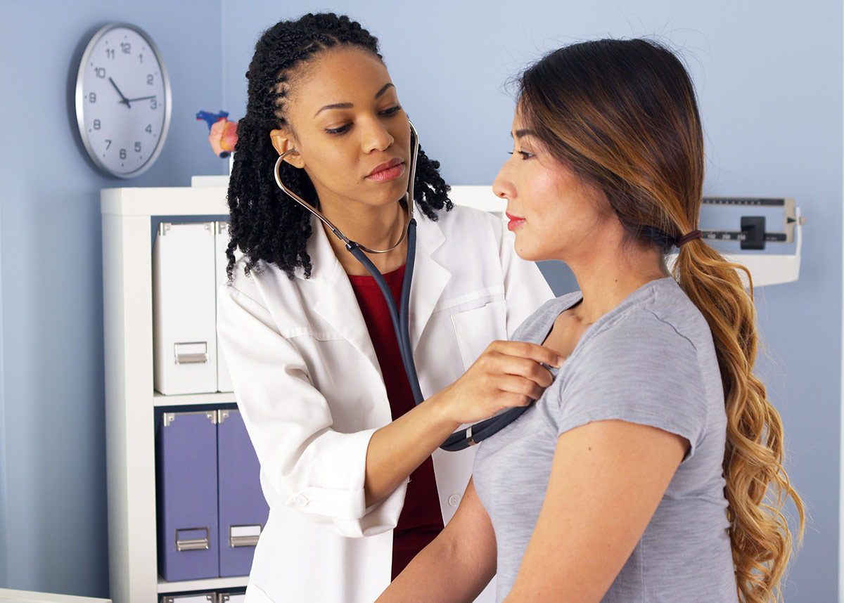 doctor listening to the heart and lungs of a patient