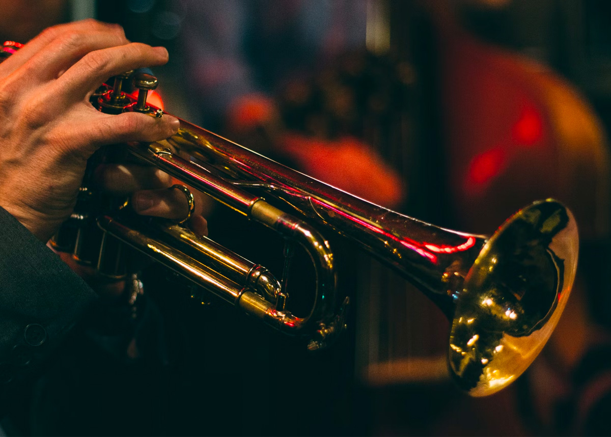 close up of person playing a trumpet