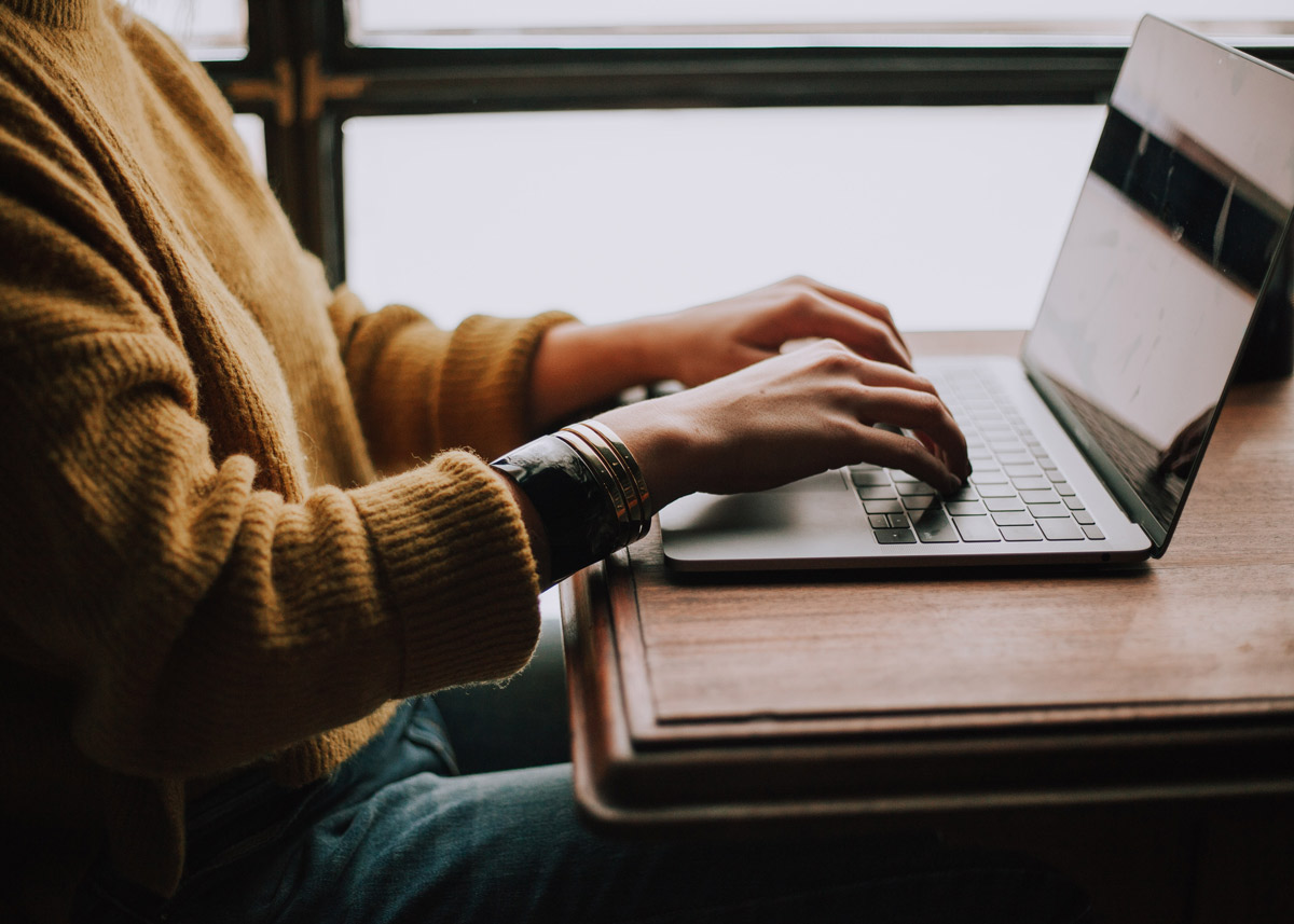 person typing on a computer