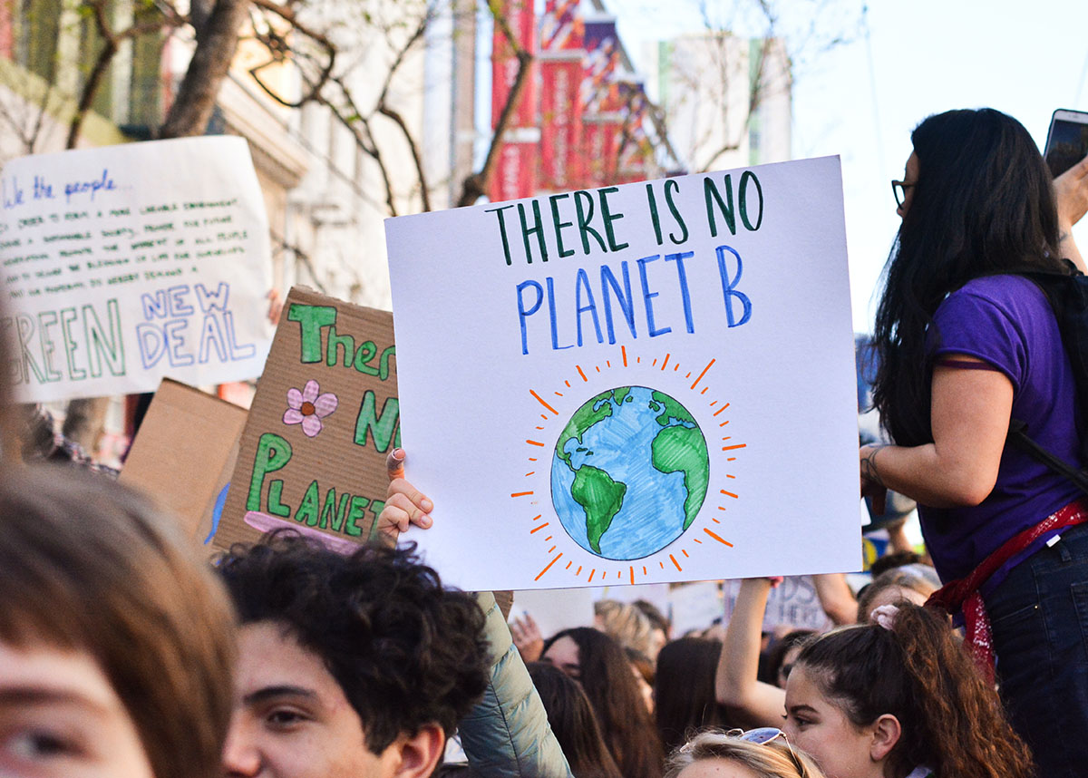 Close up of sign at climate change protest reading 