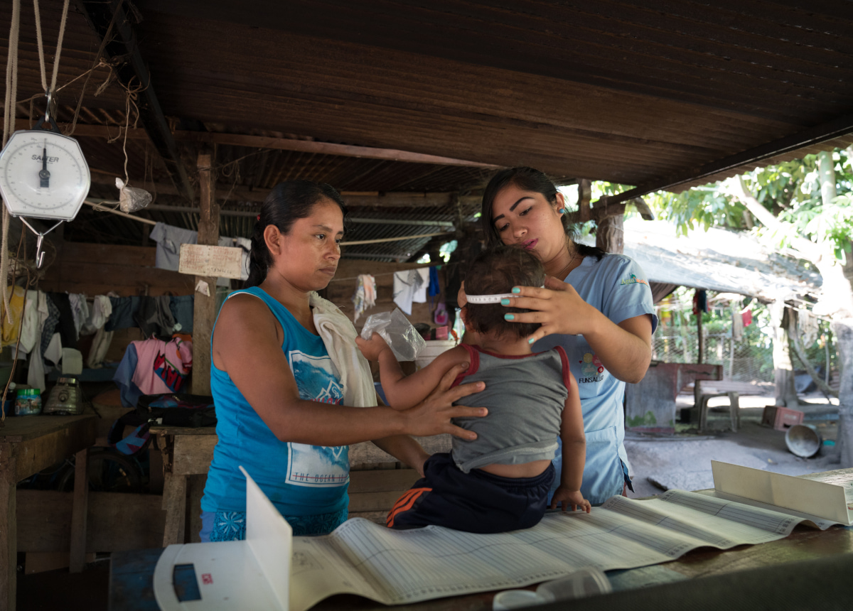 woman and child getting check up