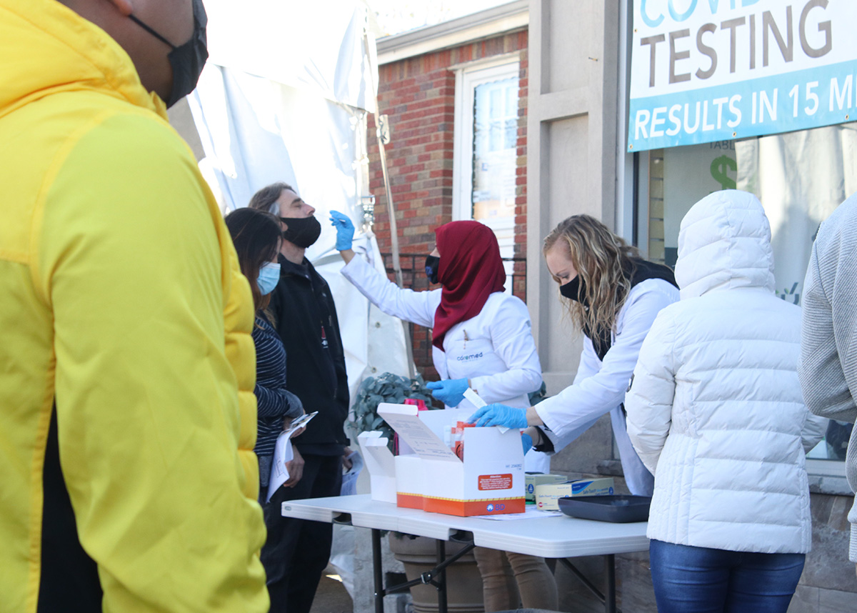 People being tested for COVID at an outdoor testing site