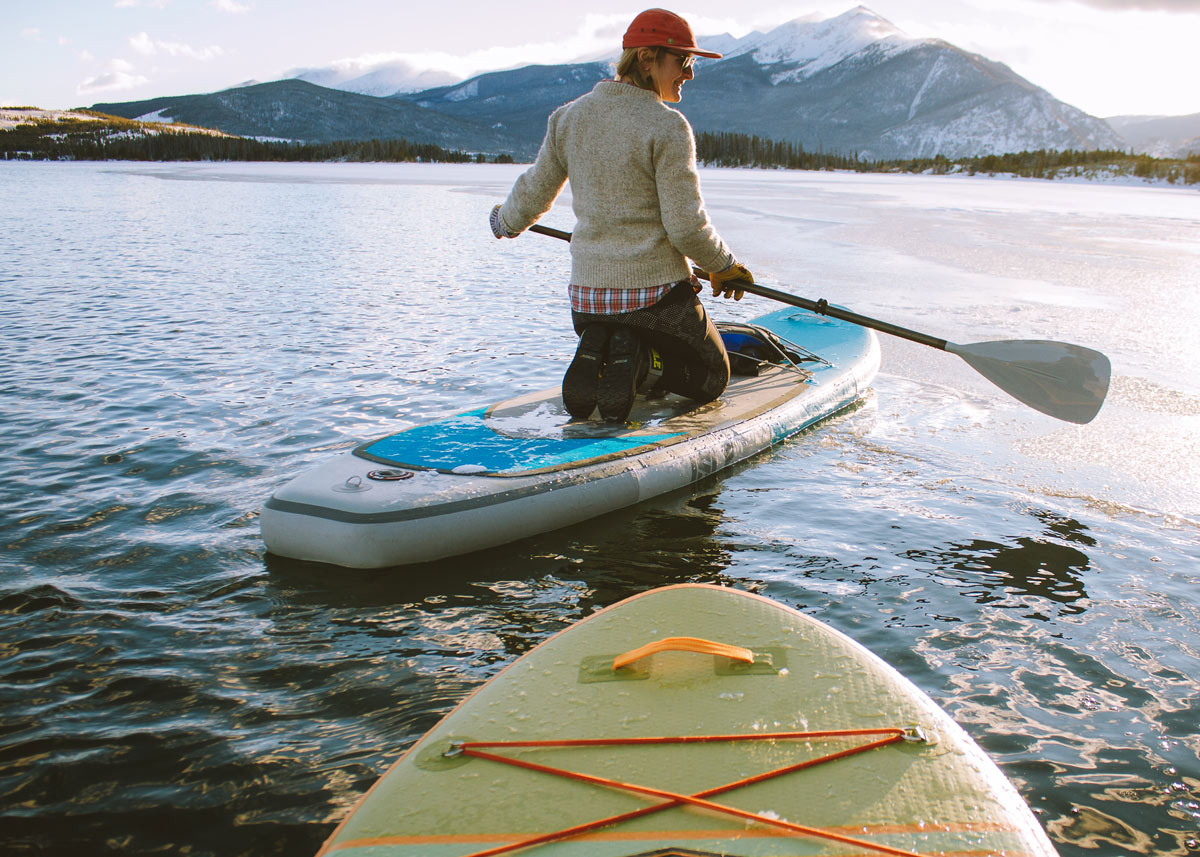 person paddleboarding