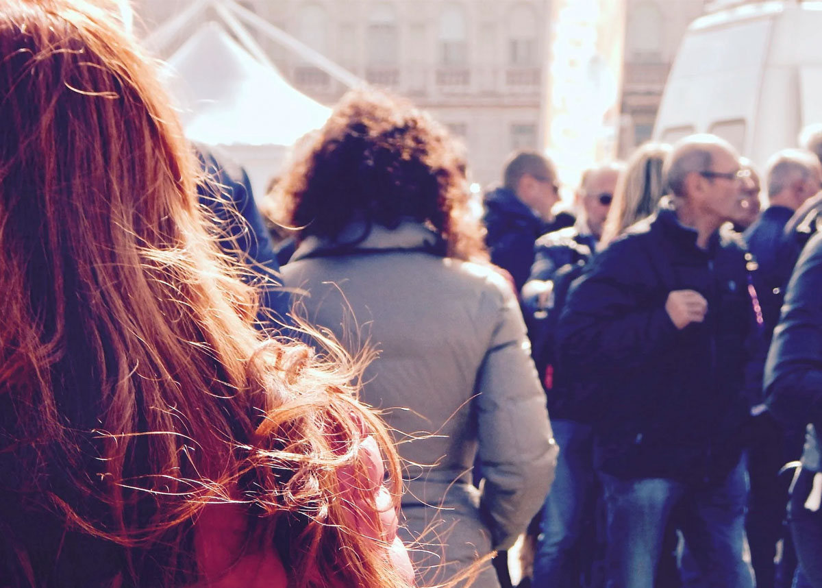 People walking on crowded sidewalk