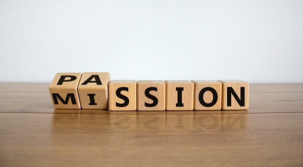 wooden blocks spelling out word mission