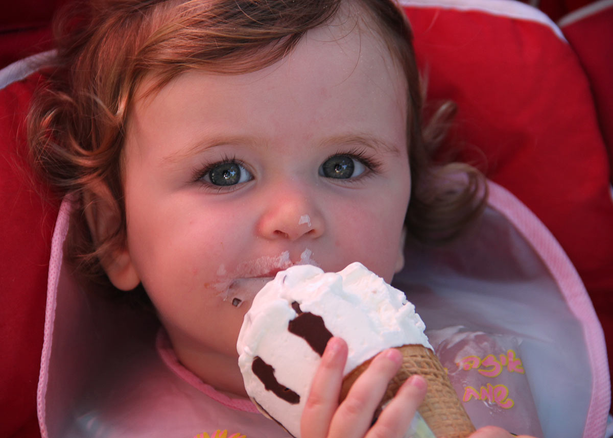 young child eating ice cream