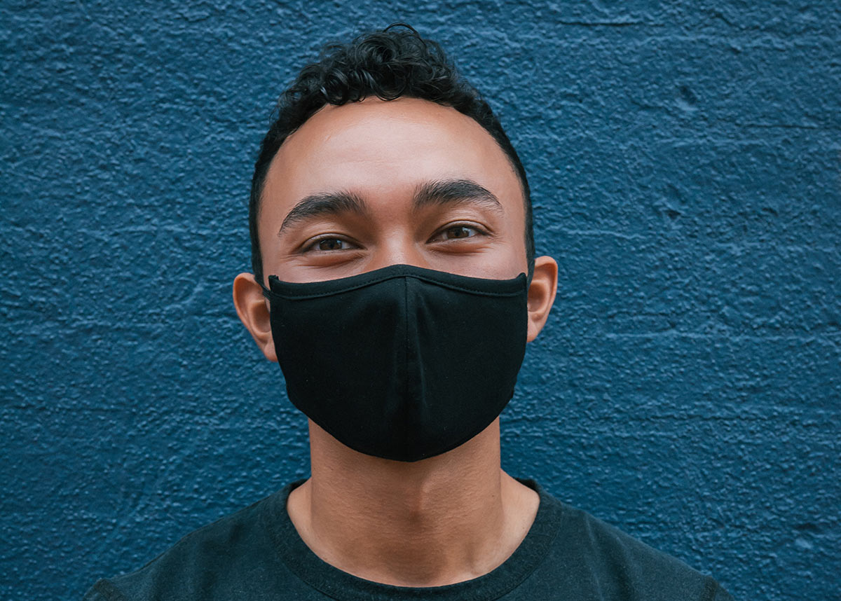 young man wearing a mask