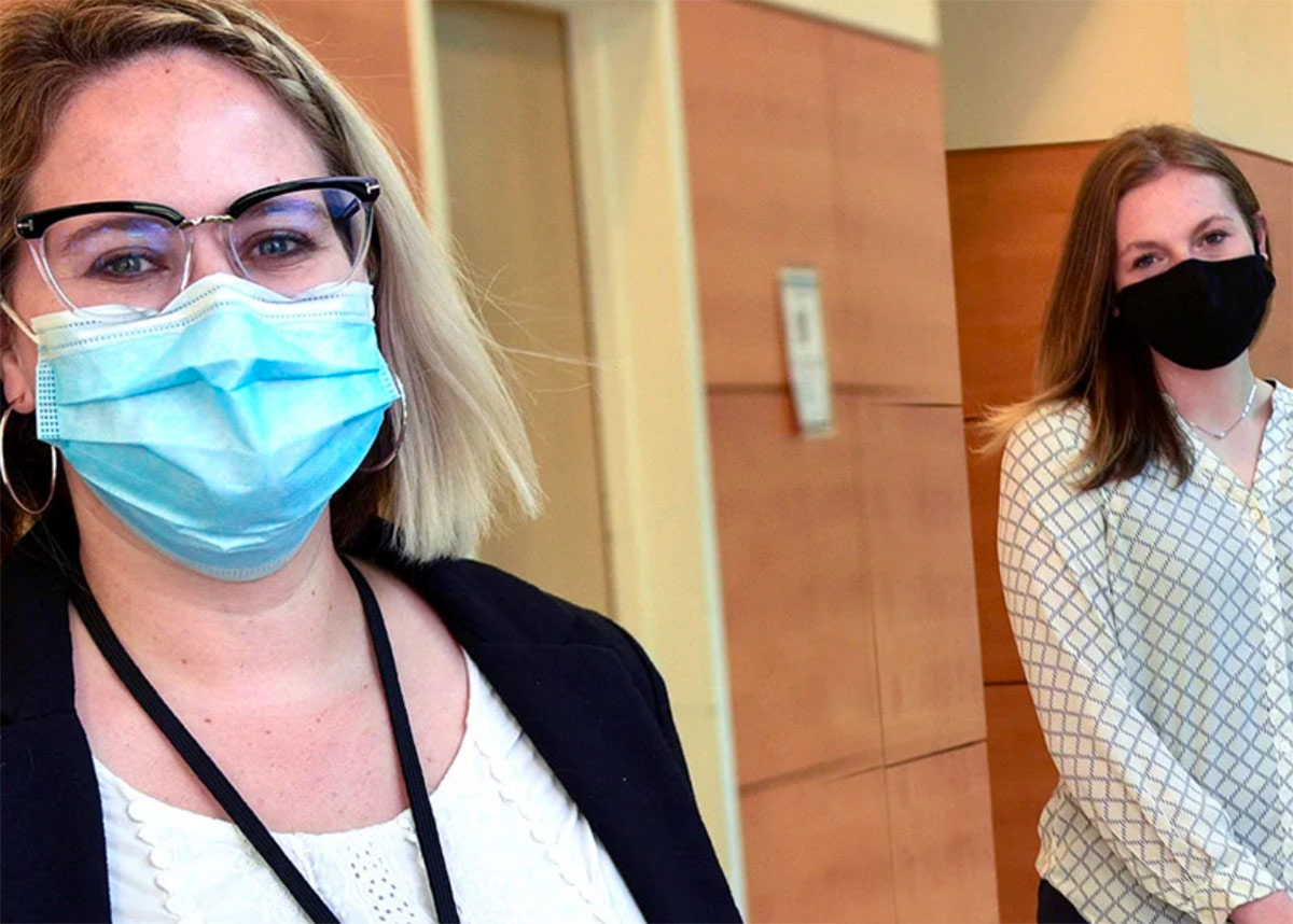 two women in face masks