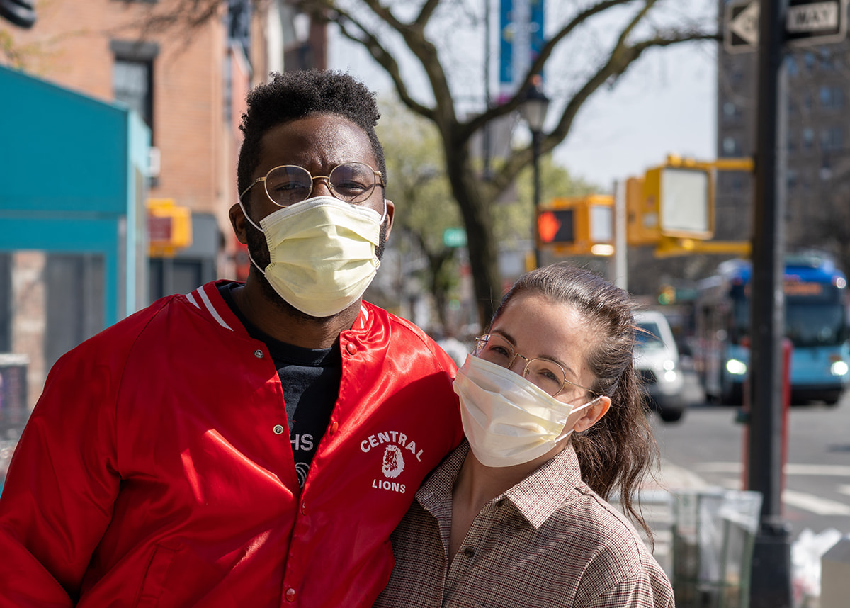 Young adult friends wearing masks