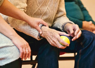 Man using ball for physical therapy