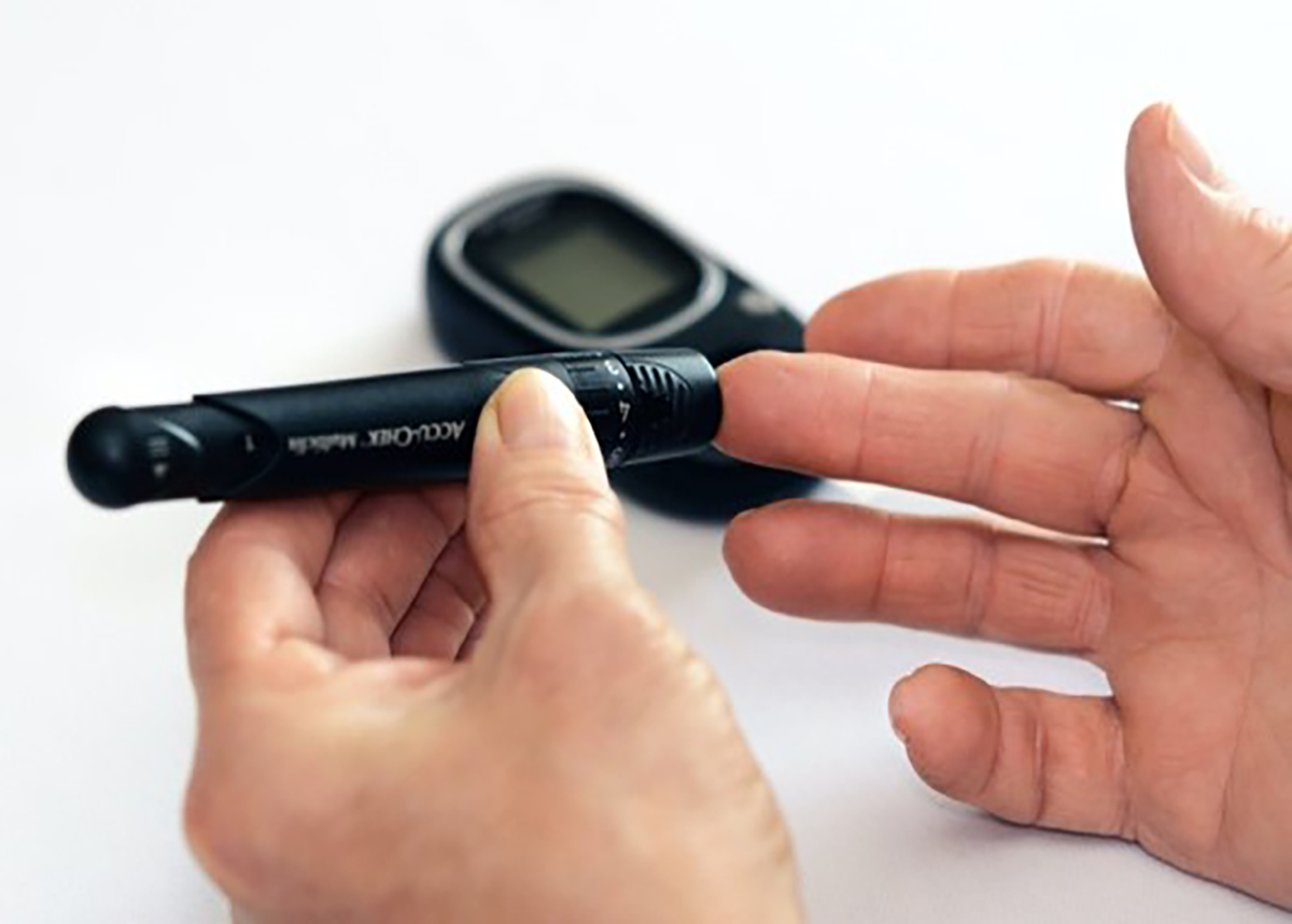 Close up of finger prick to test blood sugar