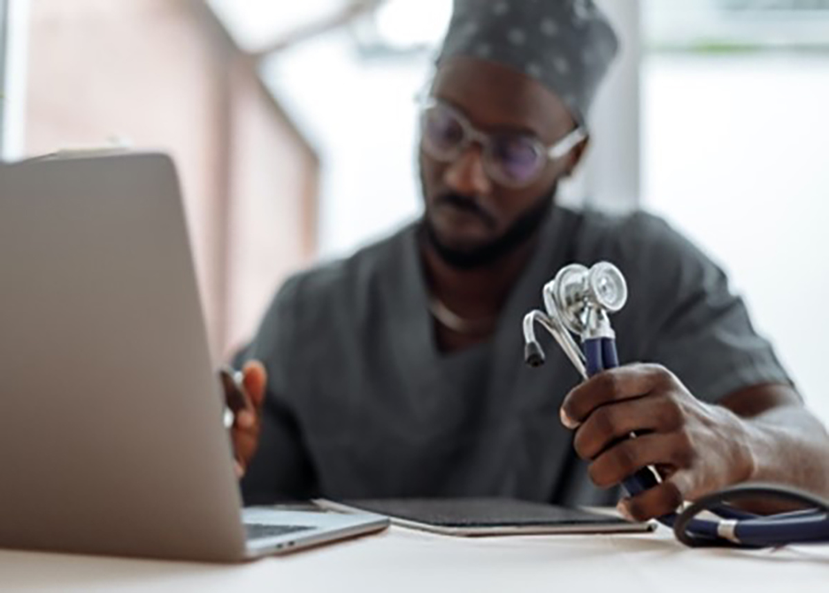 Physician working on a laptop