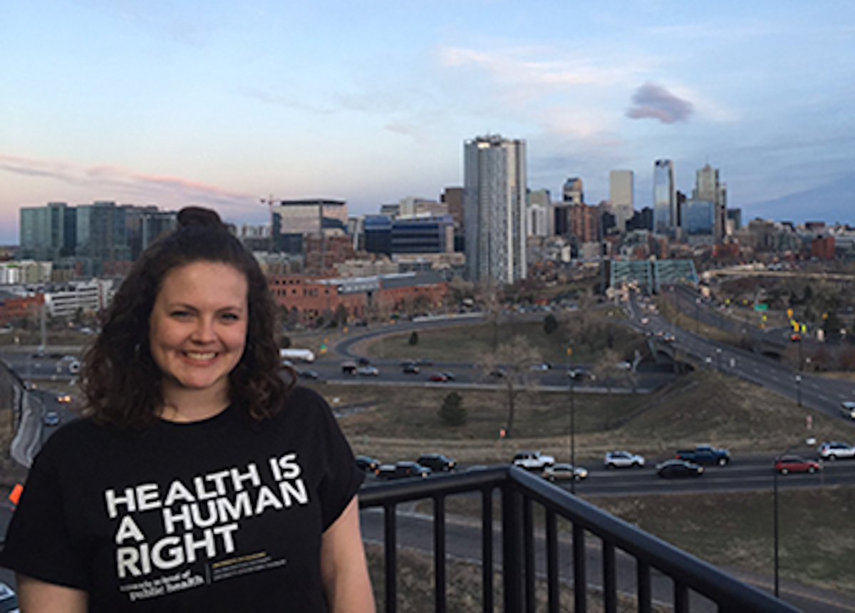 photo of kim in front of downtown Denver