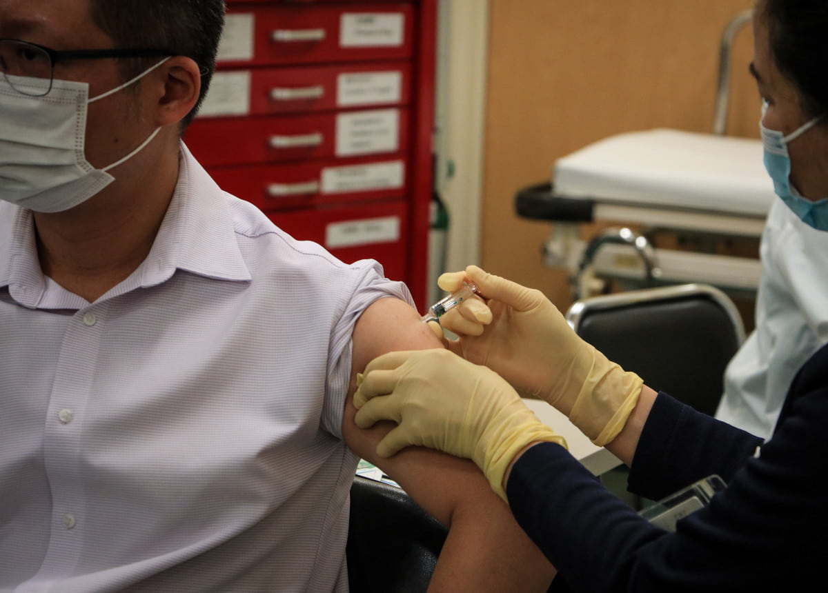 man receiving vaccine 