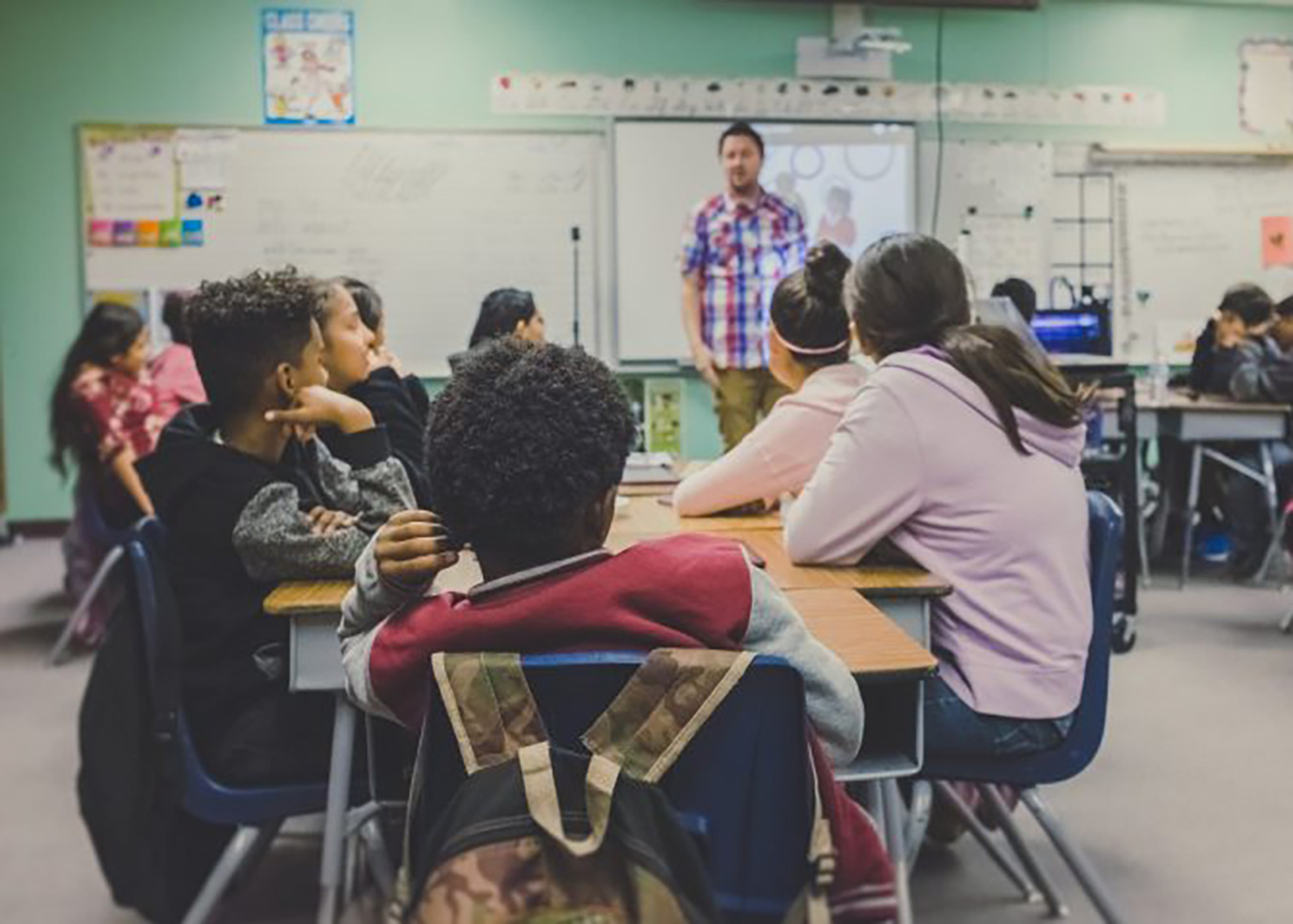 Classroom of children listening to teacher