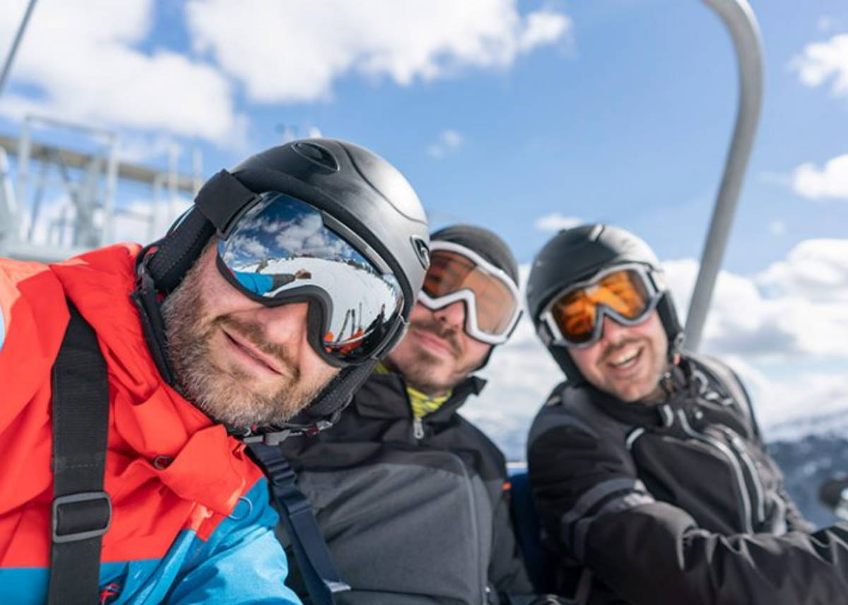 Three men enjoying a ski trip