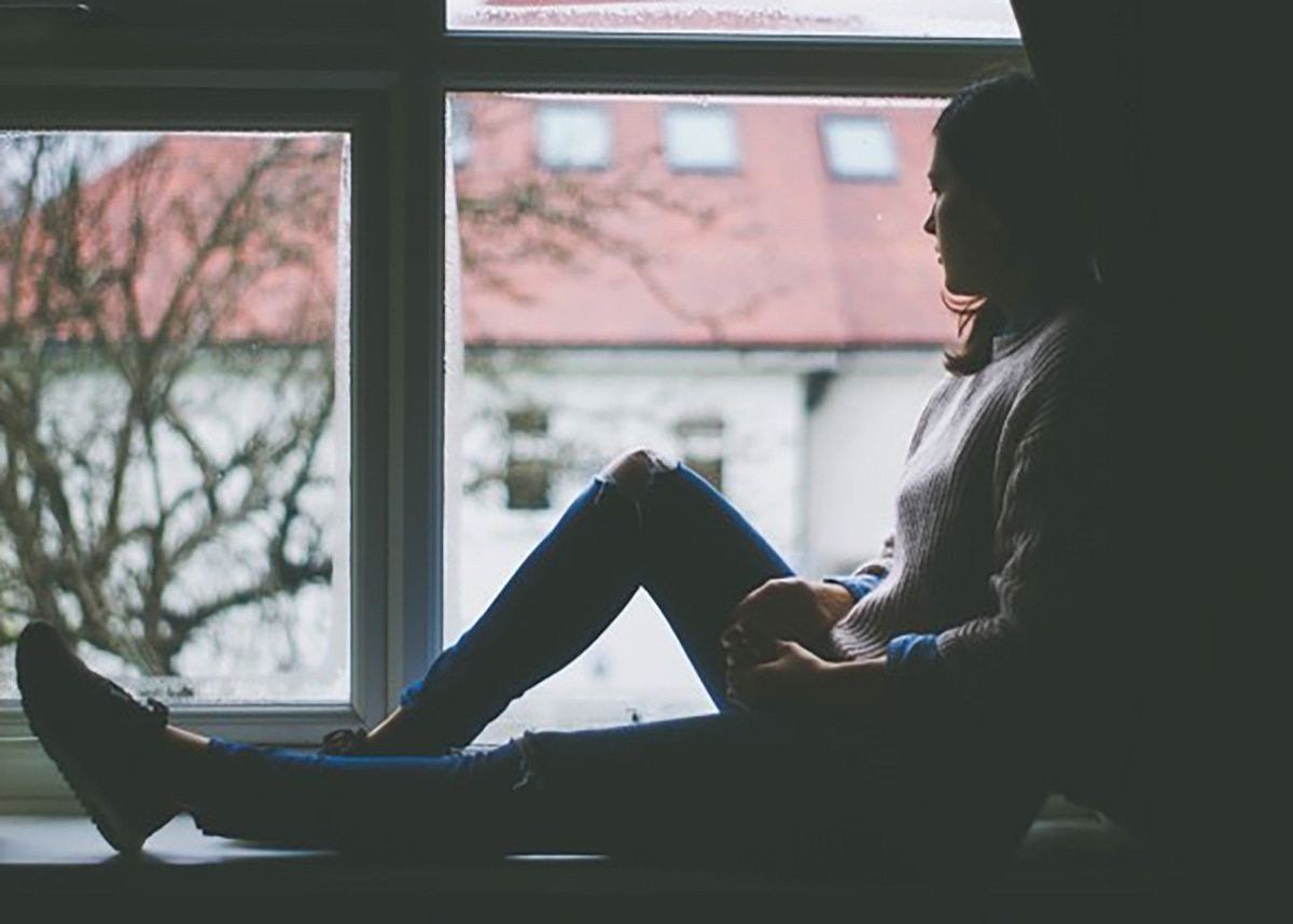 Women sitting on a windowsill