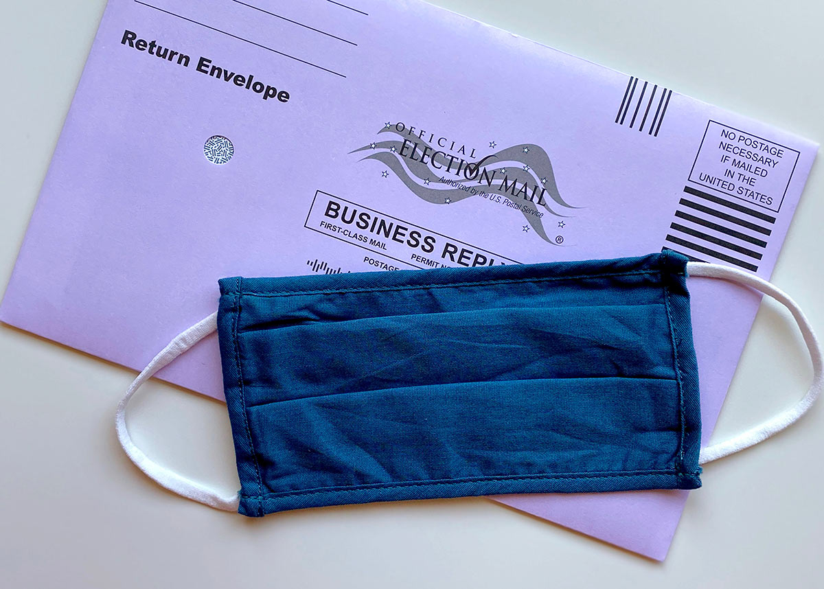 election mail envelope with face mask on top