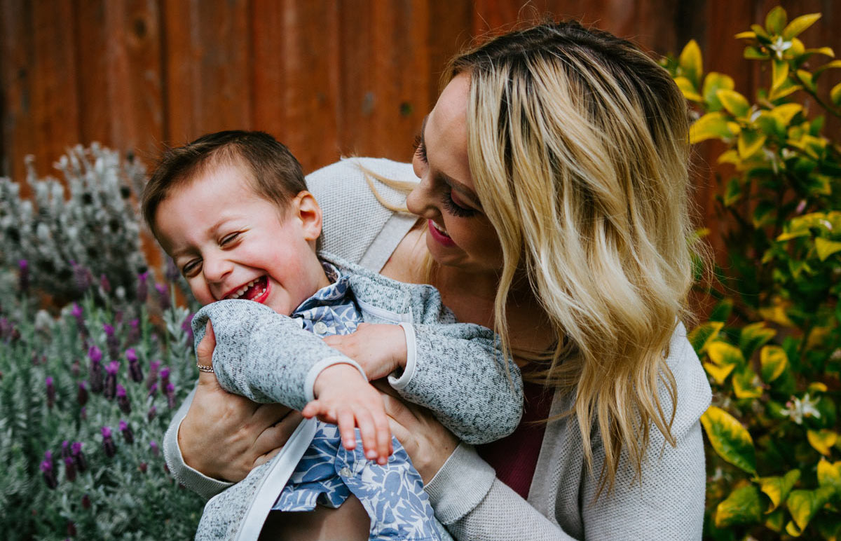 mother looking at a laughing child