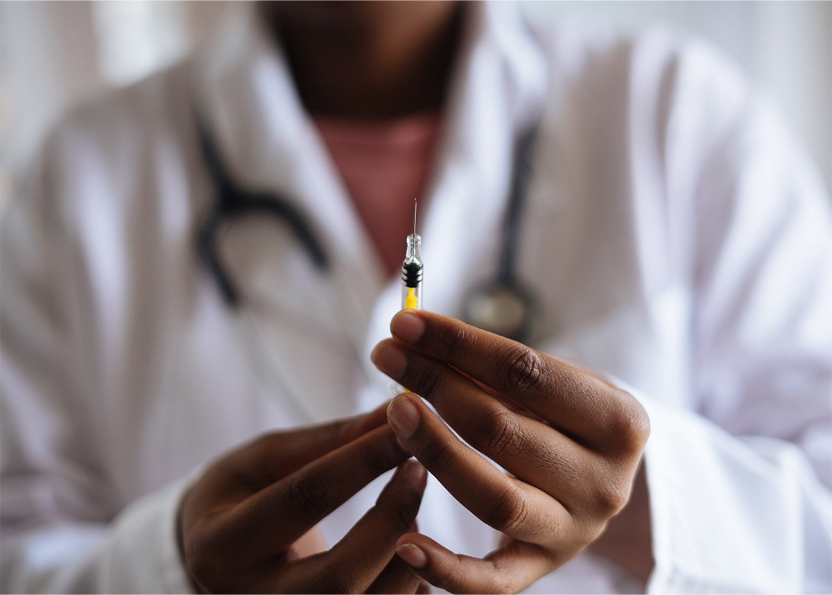 Medical professional holding vaccine