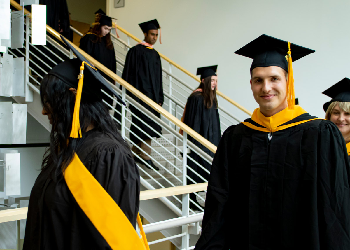 ColoradoSPH graduate walking and smiling