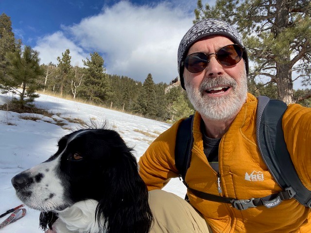 Paul Ogden smiling with a dog