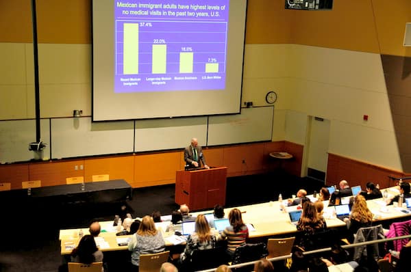 People attending a  class in an auditorium