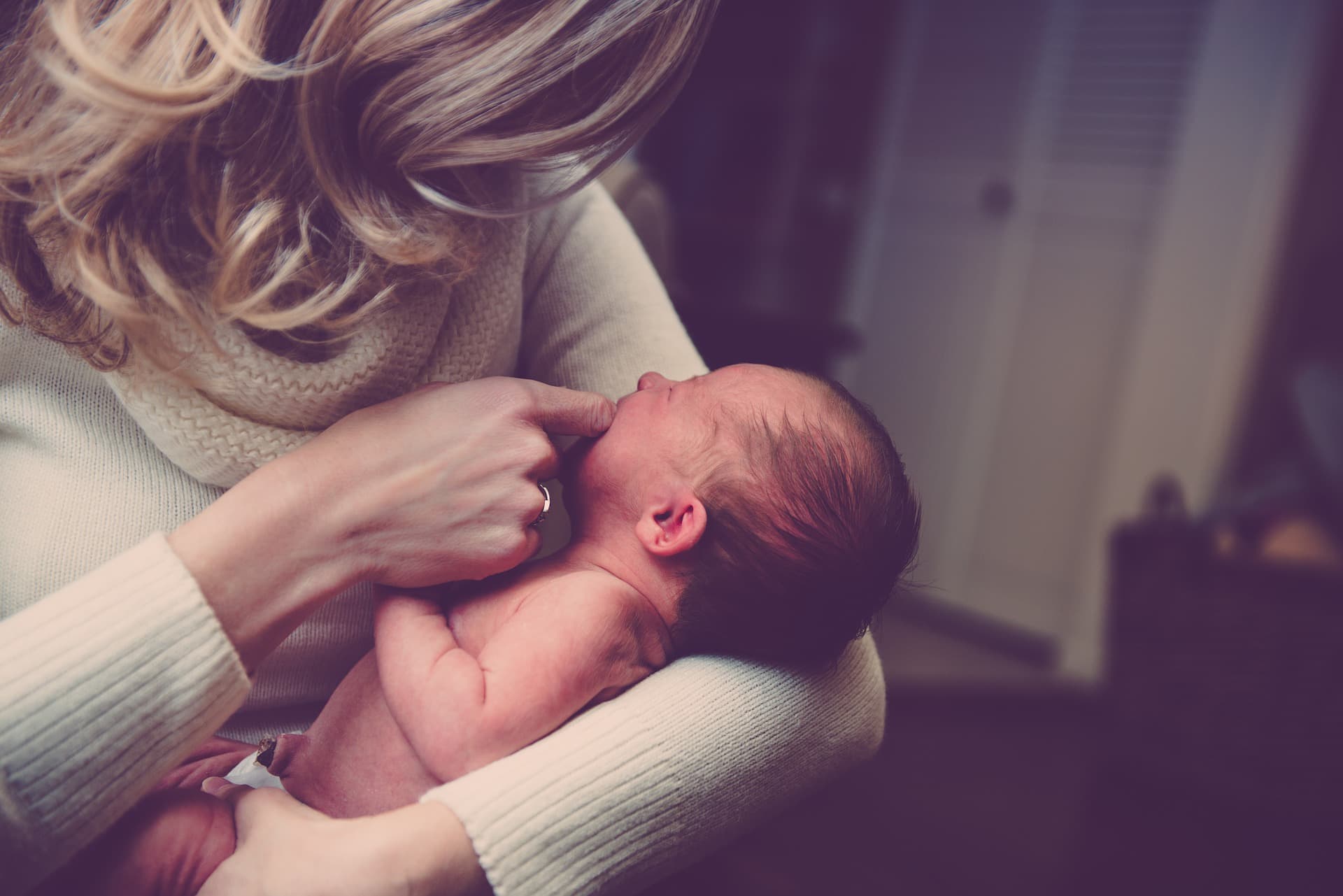 mother cradling infant