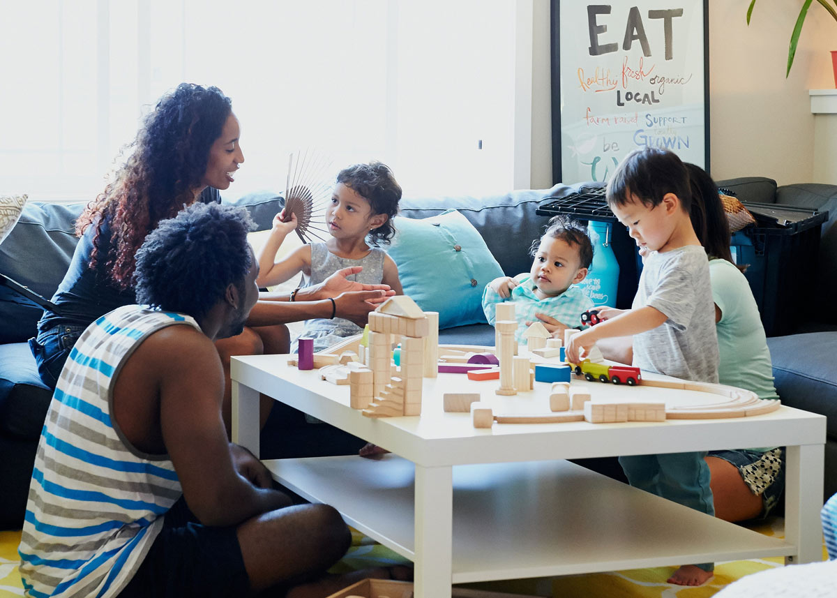 gathering of children and adults in a living room