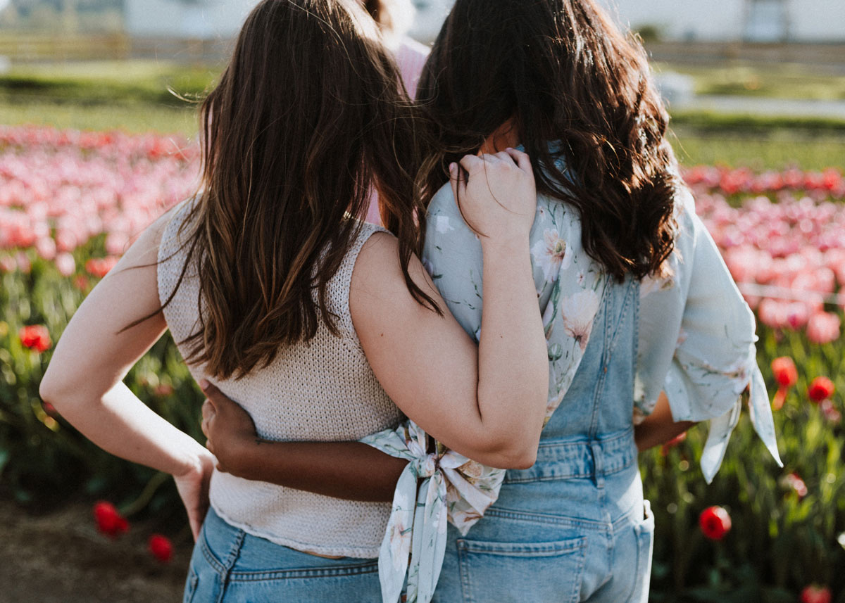 two people wrapping their arms around each other