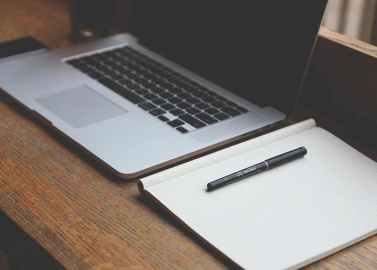 laptop and notepad on desk