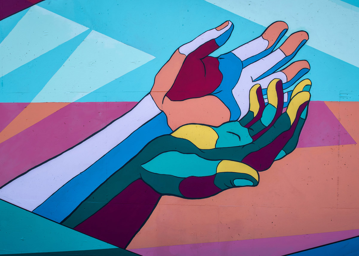 hands painted in a mural