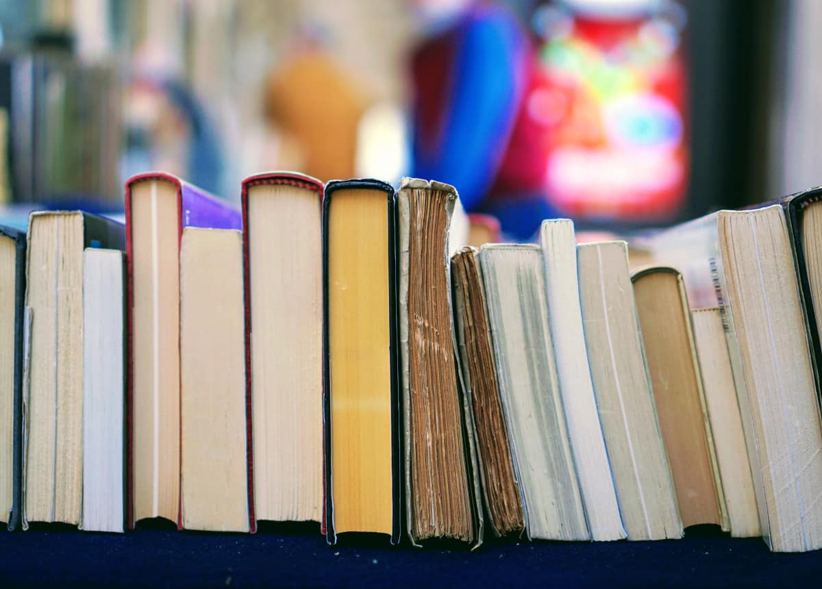 various colorful books stacked side by side