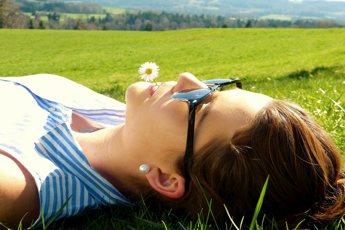 woman laying in a field