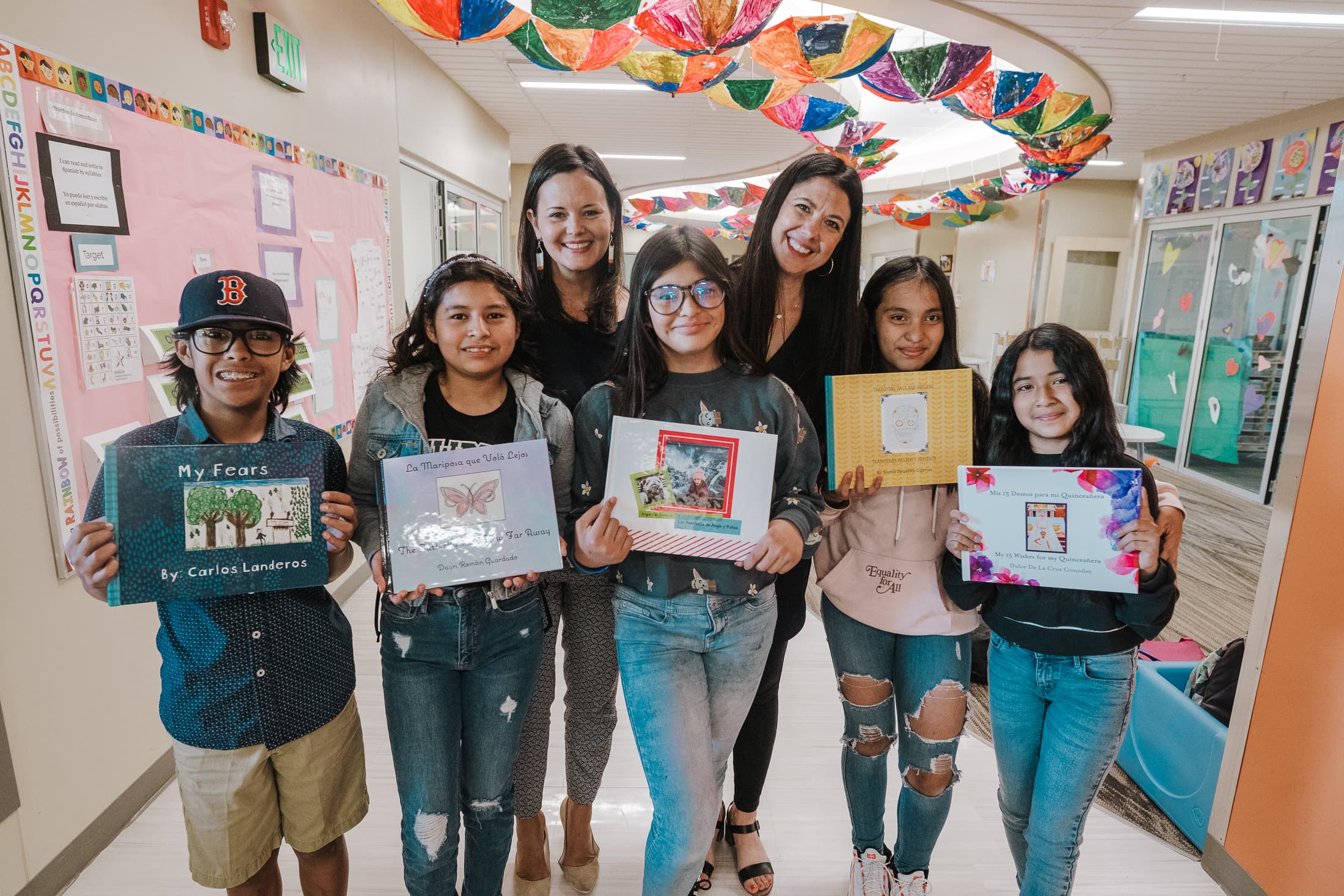 Dr. Alvarez with Adria Padilla-Chavez, PhD candidate, and 6th graders who wrote original bilingual books for their former elementary school.