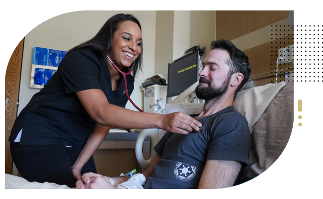 Female nurse listens to hearbeat of male patient in hospital