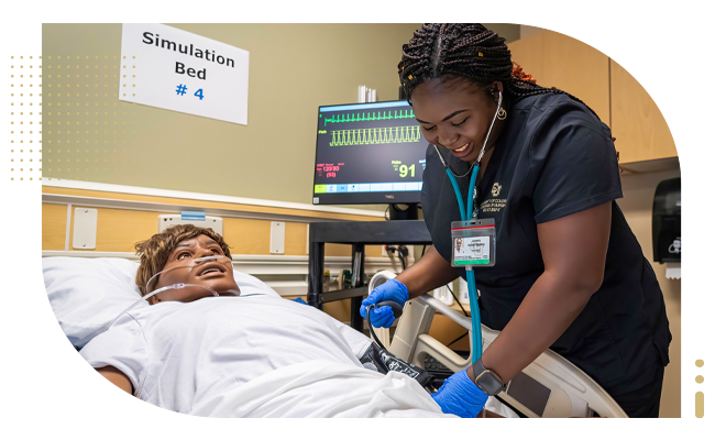 Female student nurse takes blood pressure in simulation lab