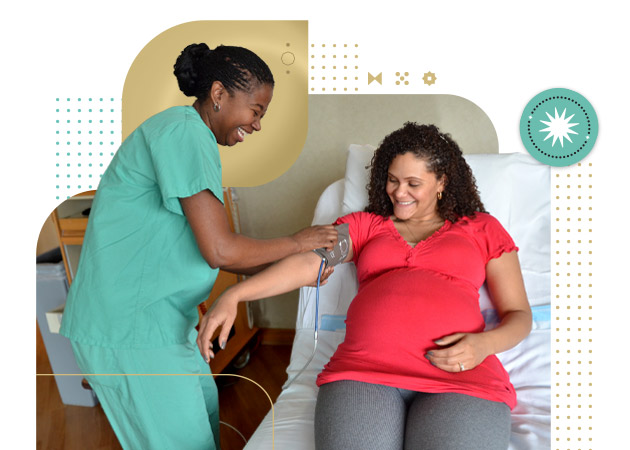 Female nurse takes bloods pressure from female patient