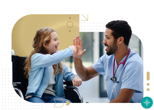 Young multiracial doctor having fun with little girl on a wheelchair