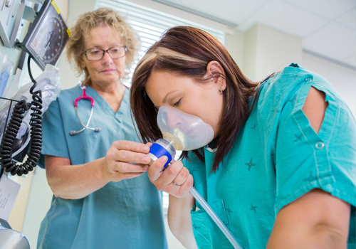 Nurse with patient receiving nitrous oxide