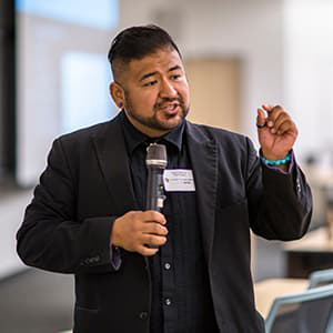 Person speaking on microphone