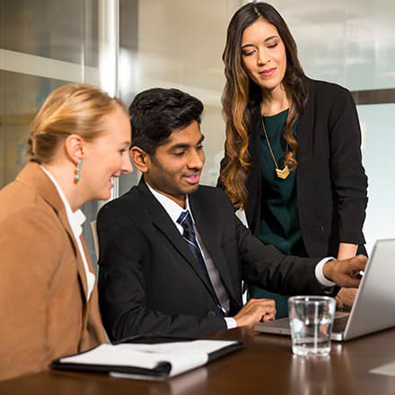 Group of diverse students at computer